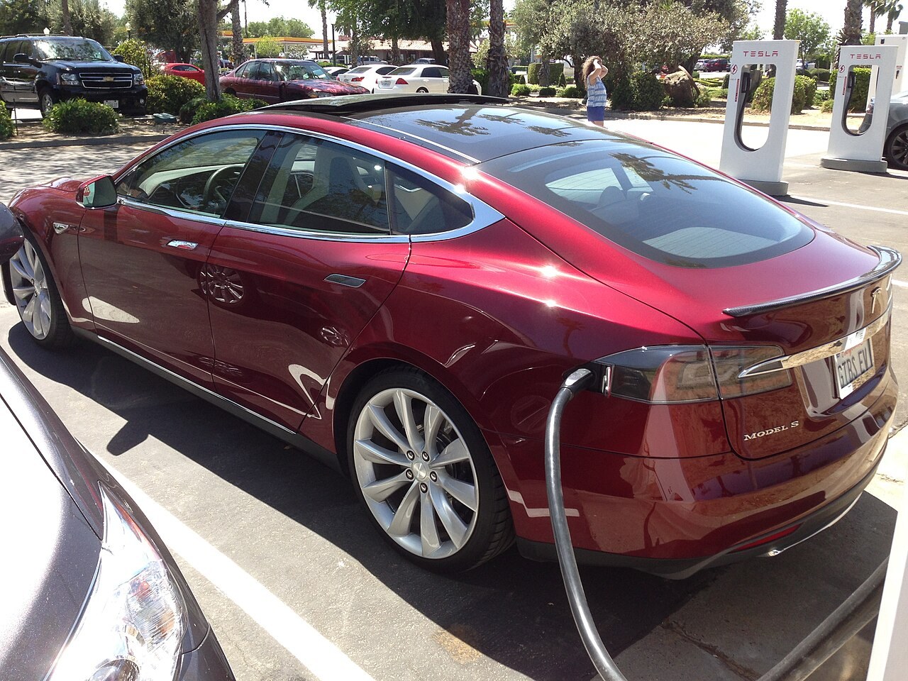 A Tesla Model S at the Harris Ranch Supercharger in California, April 2013. Charging context; prices and access policies have changed since this photograph.