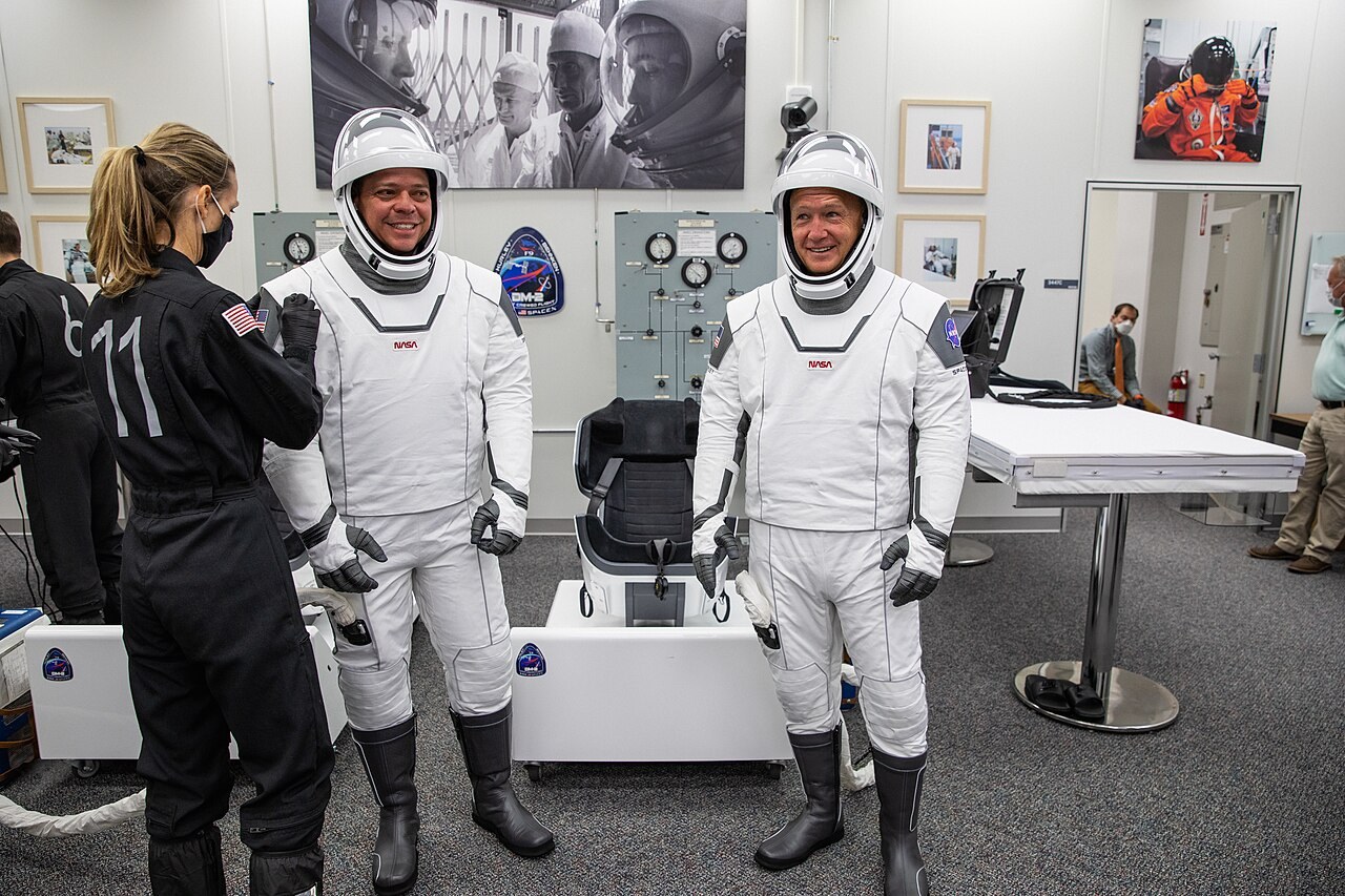 NASA astronauts Robert Behnken (left) and Douglas Hurley suit up at Kennedy Space Center before the Demo-2 launch, May 30, 2020.